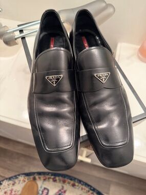 Vintage Prada Black Leather Slip-On Loafers with Metal Logo